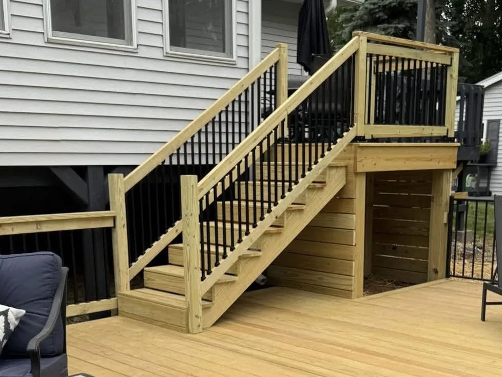 New custom pressure-treated deck with stairs and under-deck storage in Pekin, Illinois
