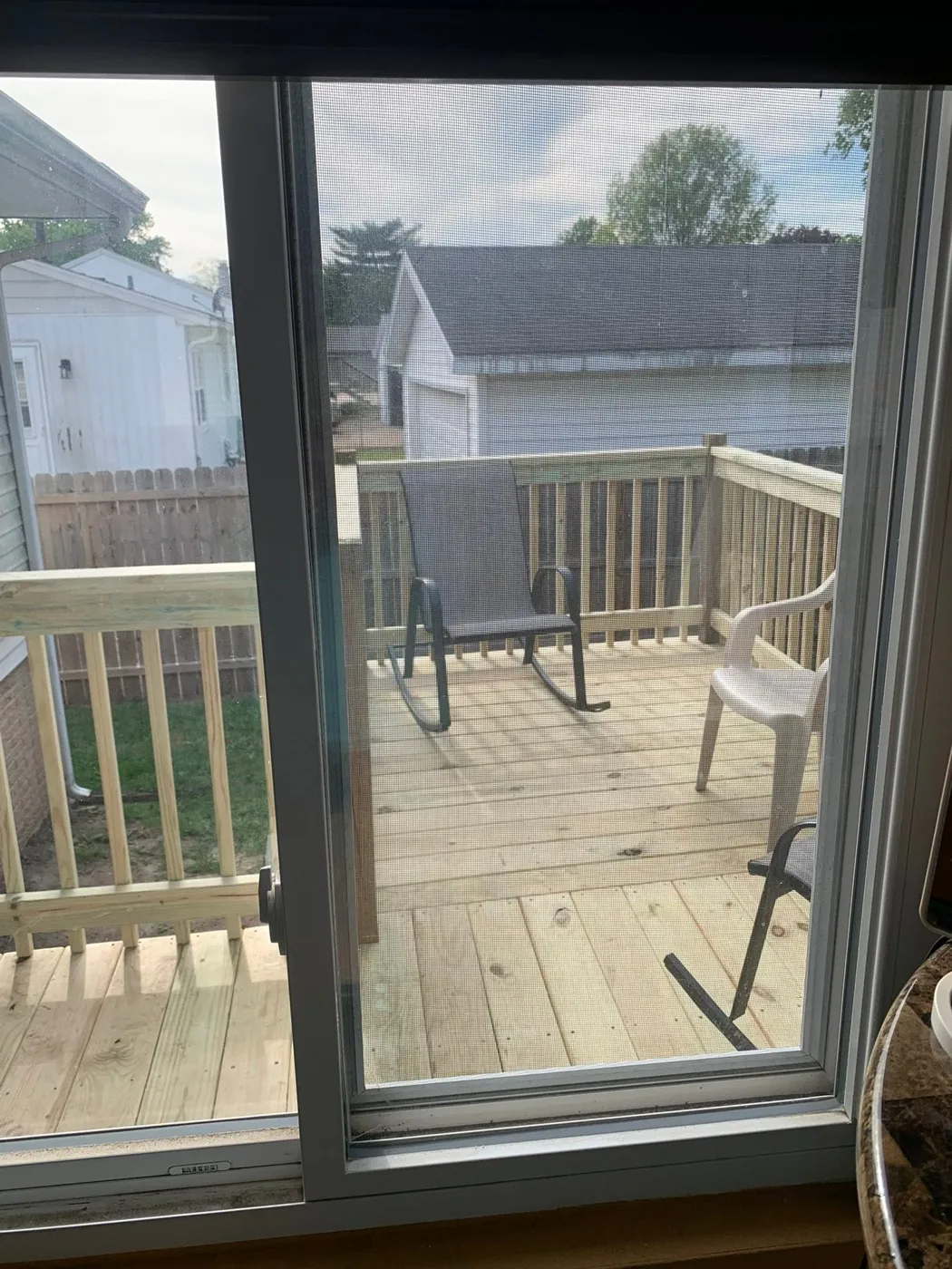 Custom deck positioned outside a sliding door with room for outdoor furniture