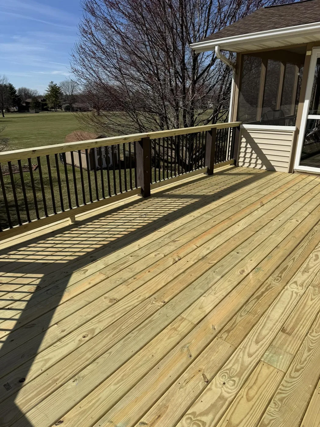 New pressure-treated wood deck